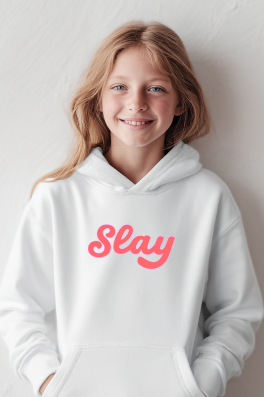 Level up her style with the cozy Slay Hoodie. This white hoodie with bold pink lettering is soft, comfy, and available in youth to adult 5XL. Perfect for birthdays, holidays, or matching family hoodies — a fun gift for girls and teens who love to slay every day. #SlayHoodie #GirlsHoodie #TeenStyle #MatchingOutfits #GiftIdeas