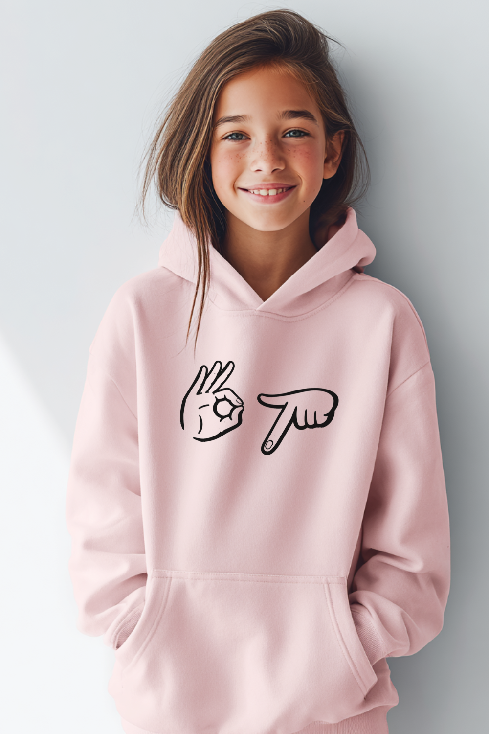 Girl wearing a pink 67 Hands hoodie with a minimalist hand gesture graphic on the front. Cozy unisex youth hoodie designed for kids and teens, available in multiple colors and sizes.