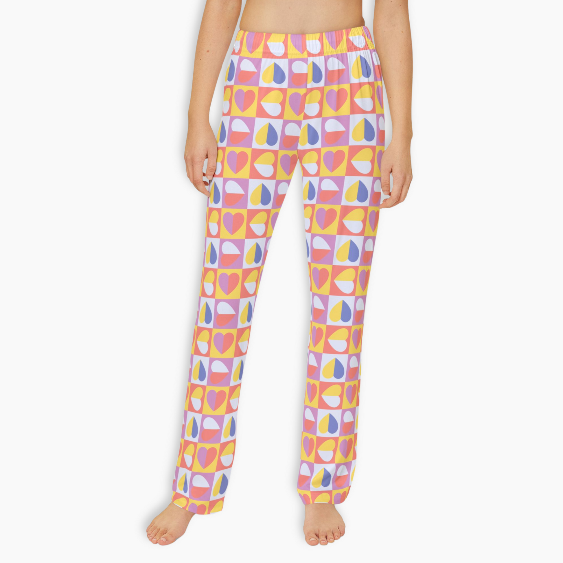 Vibrant youth lounge pants featuring a colorful heart and teardrop pattern in pink, yellow, blue, and white. Made from soft, lightweight brushed polyester with an elastic waistband for ultimate comfort and style. Perfect for cozy lounging or trendy casual wear for kids.