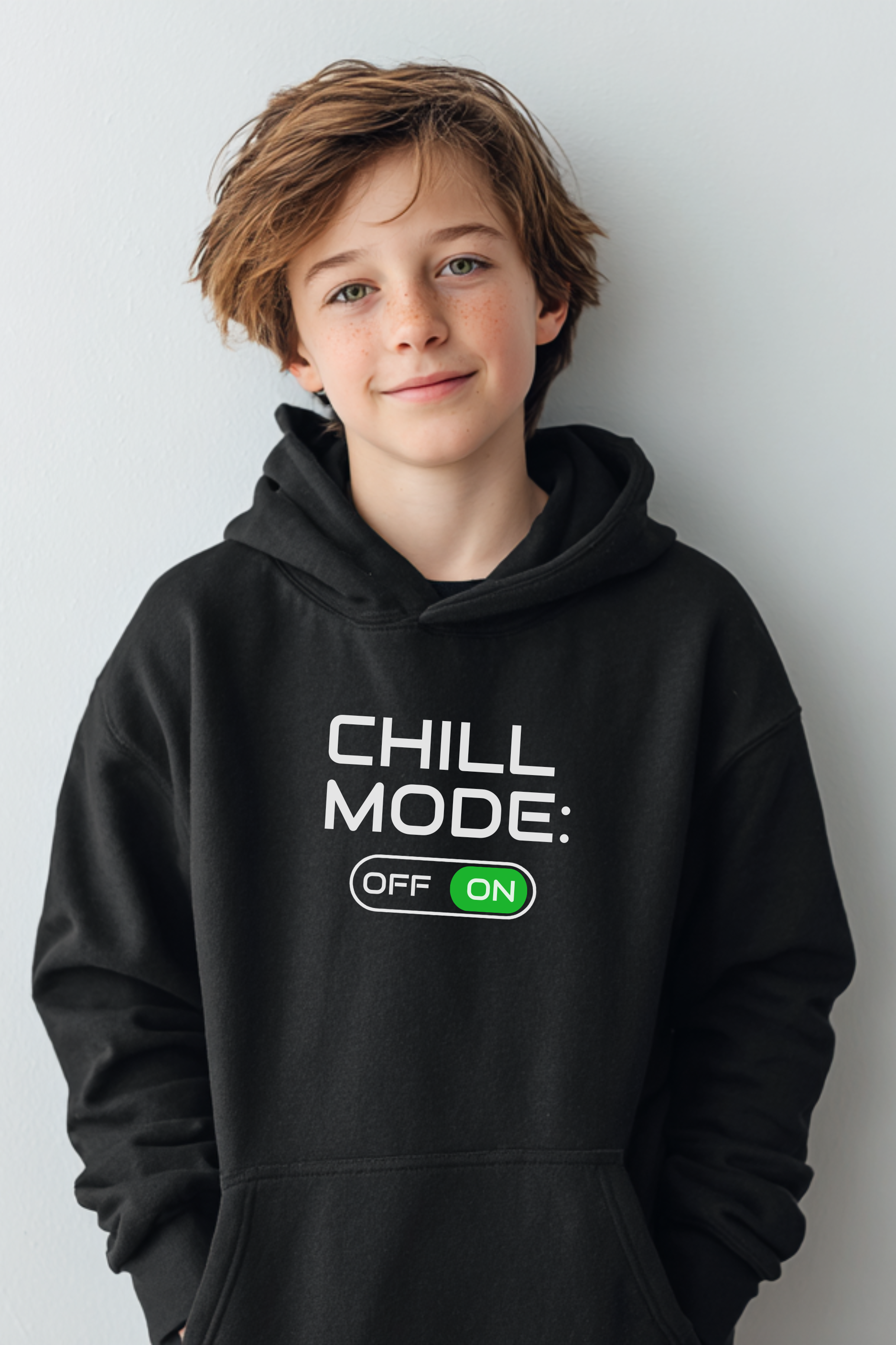 Boy wearing black “Chill Mode ON” hoodie — unisex gamer hoodie for kids and teens, cozy cotton fleece sweatshirt for boys and girls.