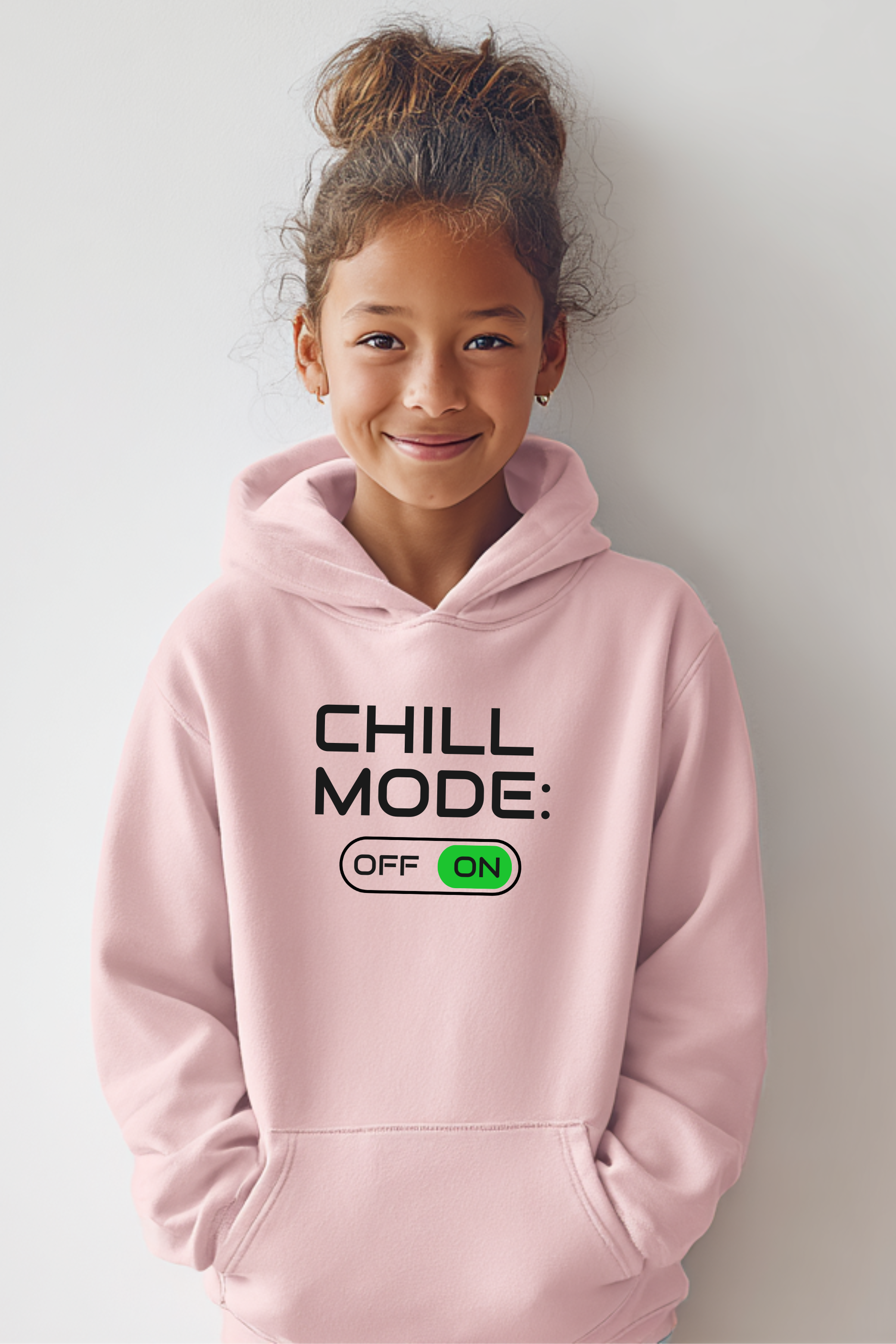 Girl wearing pink “Chill Mode ON” hoodie — cute unisex gamer hoodie for kids and teens, soft fleece sweatshirt for girls and boys.