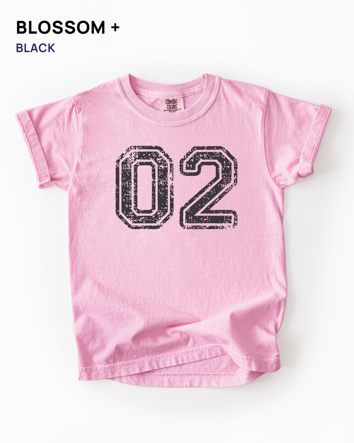 Custom varsity number tee in Blossom pink with a black distressed varsity number