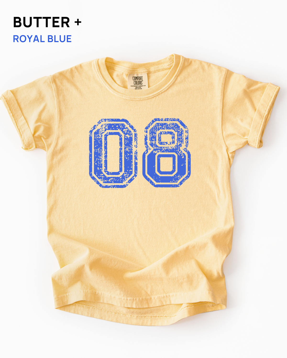 Custom varsity number tee in Butter yellow with a royal blue distressed varsity number