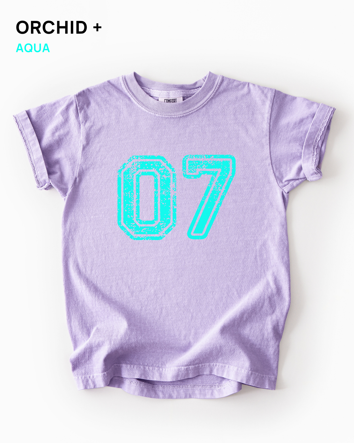 Custom varsity number tee in Orchid purple with an aqua distressed varsity number
